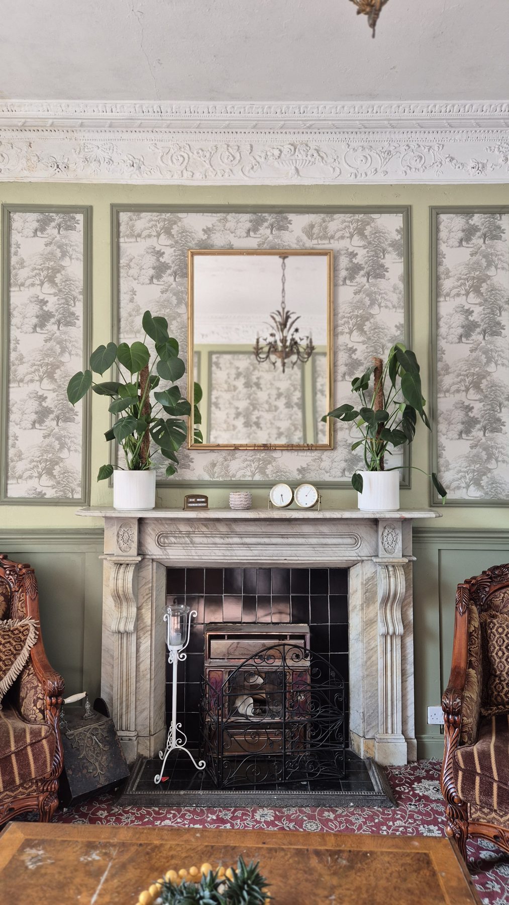 Grand drawing room with ornate cornicing and marble fireplace